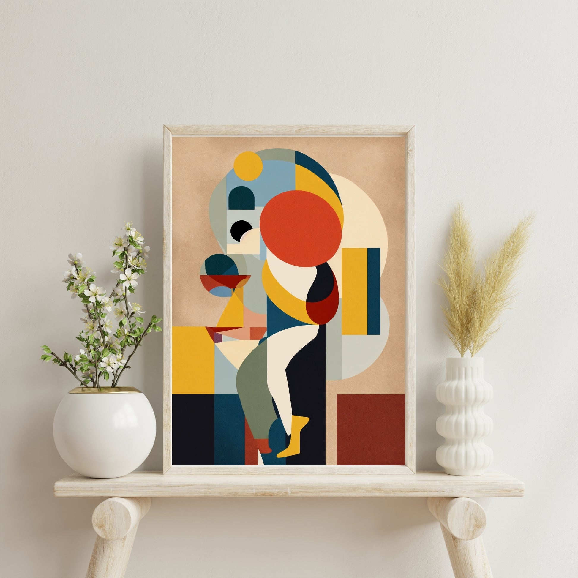 Colorful abstract geometric art print featuring bold shapes and vibrant colors, displayed in a wooden frame on a stylish shelf with modern decor.