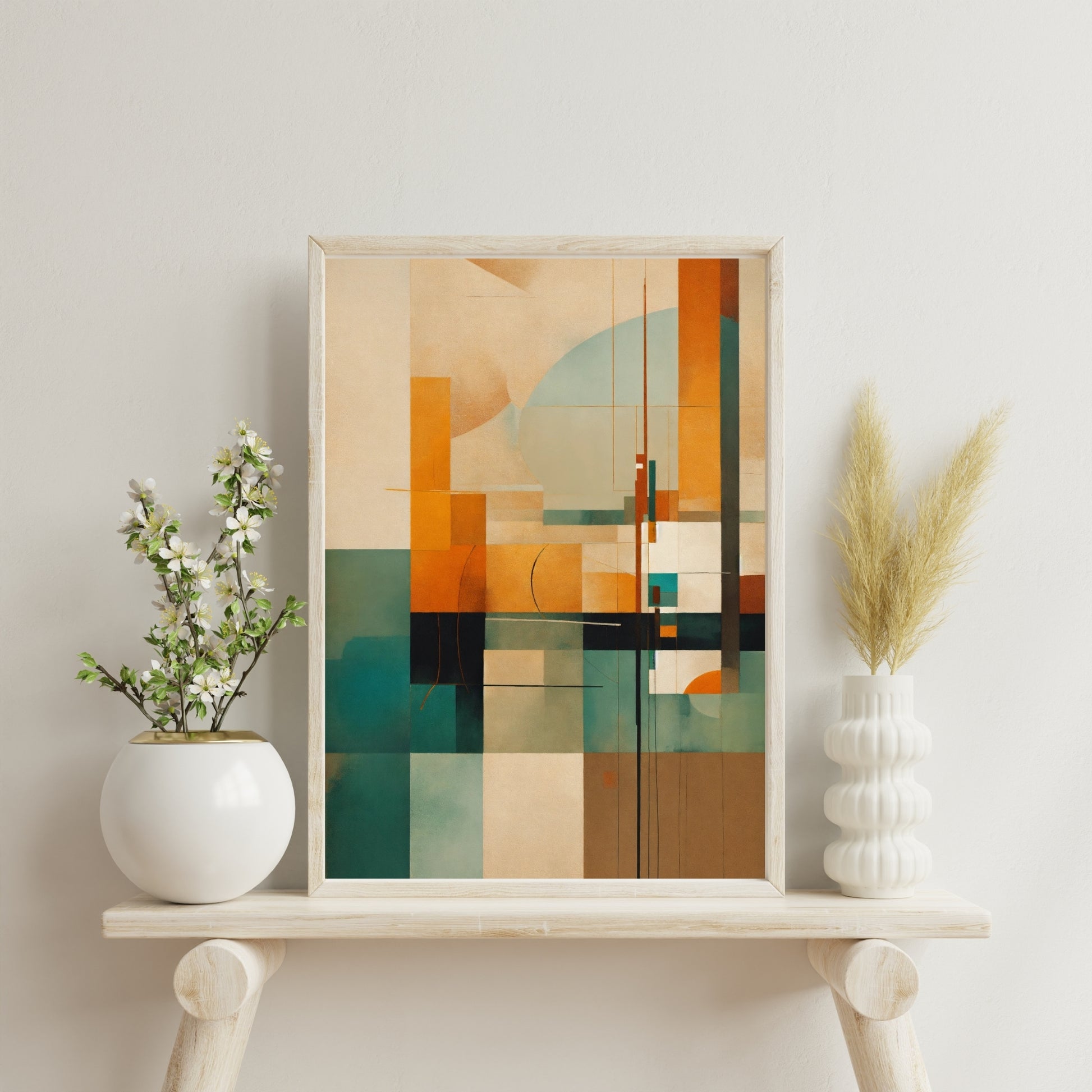 Abstract geometric art print featuring earthy tones and modern shapes displayed in a wooden frame on a stylish shelf.