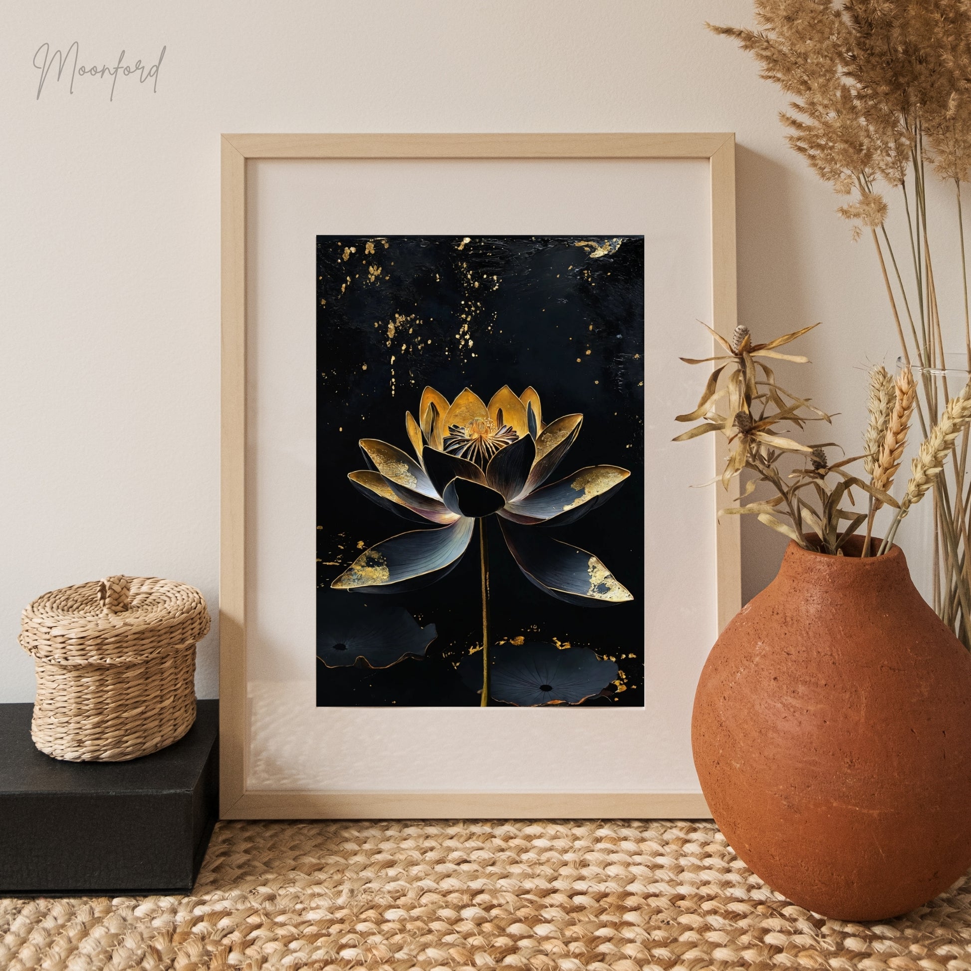 Black and gold lotus flower digital art print displayed on a white shelf with potted plants.