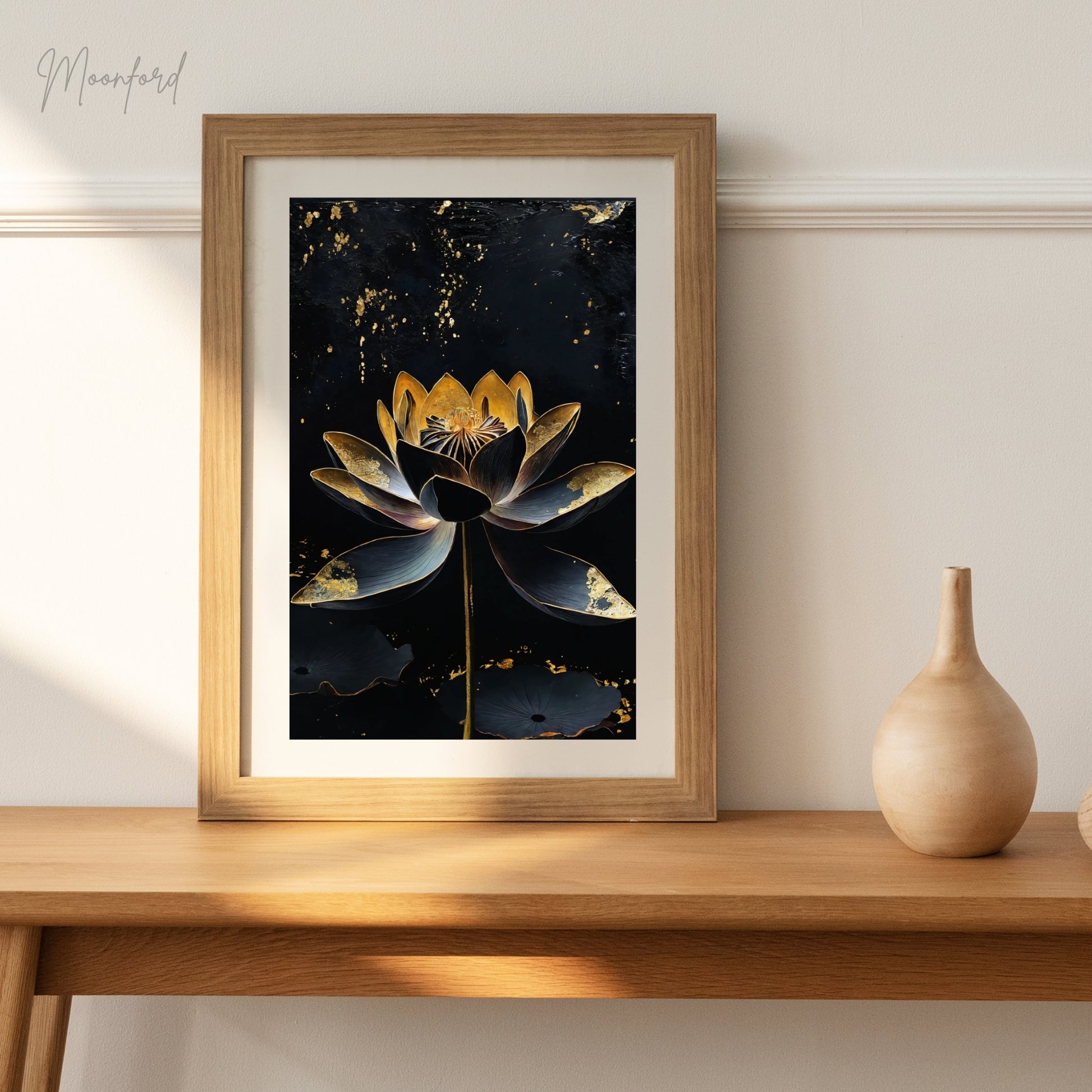 Black and gold lotus flower digital art print displayed on a white shelf with potted plants.